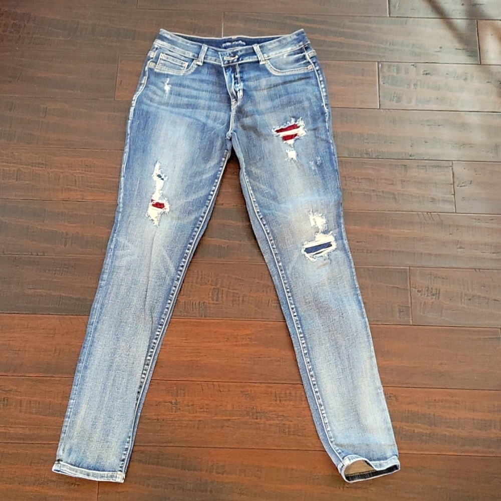 Medium wash distressed skinny jeans.